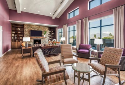 Bright common area with comfortable seating and large windows
