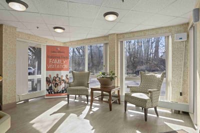Bright interior corner seating area with welcoming signage