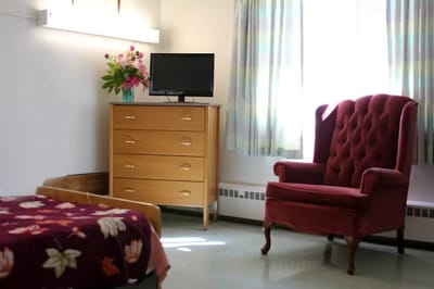 Cozy resident room with furniture and decor