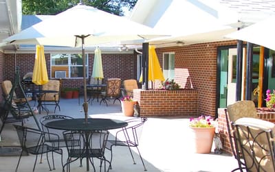 Outdoor patio area with seating and umbrellas