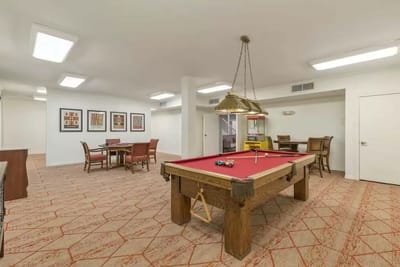 Interior view of a game room with a pool table