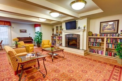 Cozy common area with seating and bookshelves