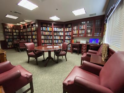 Interior view of a library with bookshelves and seating