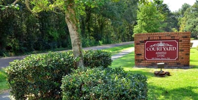 Entrance sign for Courtyard Assisted Living facility