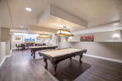 Common area with billiard tables and seating
