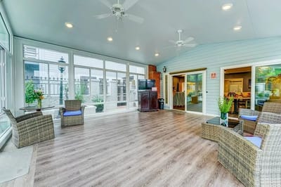 Bright common area with seating and large windows