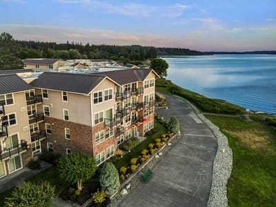 Aerial view of a multi-story building by the water