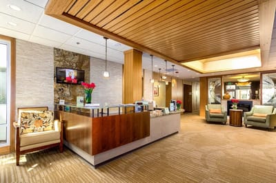 Bright lobby area with seating and reception desk