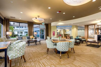 Bright common area with seating and tables
