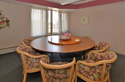 Interior view of a common area with a round table