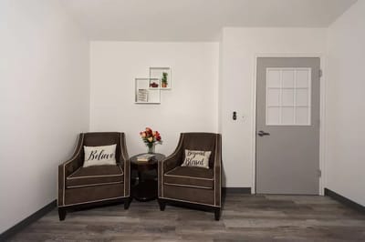 Cozy lounge area with two armchairs and decor
