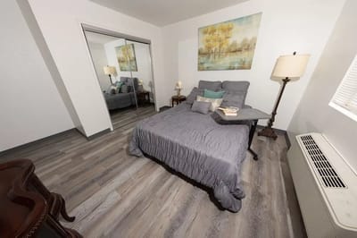 Cozy private room with a bed and artwork