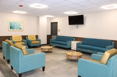 Interior common area with teal seating and tables