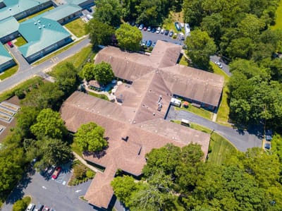 Aerial view of the rehabilitation facility surrounded by trees