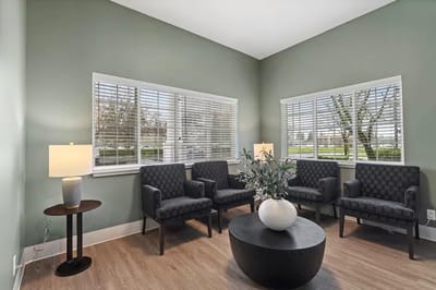 Bright common area with seating and decorative plant