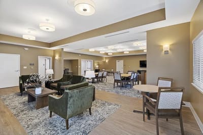 Bright common area with seating and tables