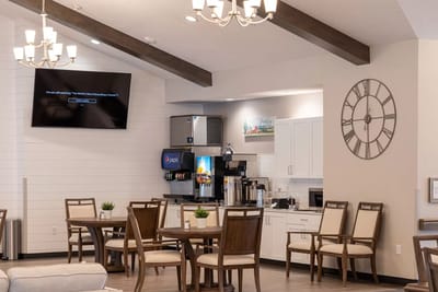 Bright common area with seating and refreshments