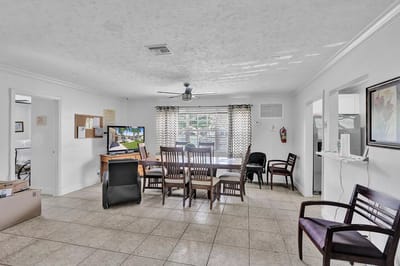 Bright common area with seating and tables