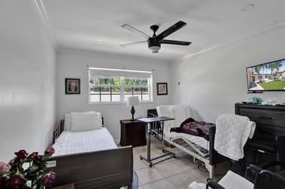 Private resident room with two beds and basic furnishings
