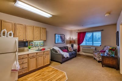 Interior view of a resident's living space with kitchen area