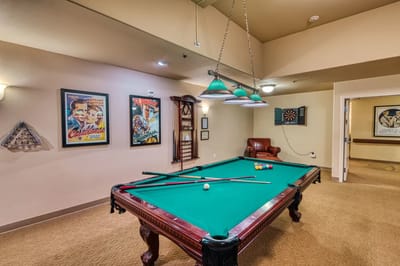 Interior view of a game room with a pool table