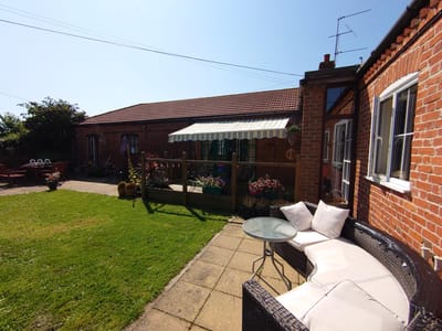 Outdoor seating area at Manor Farm with garden