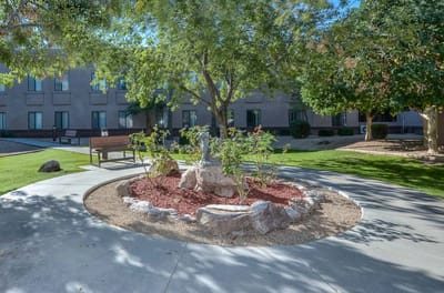 Well-maintained garden area with a seating bench