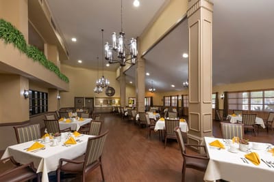 Dining area with tables set for a meal