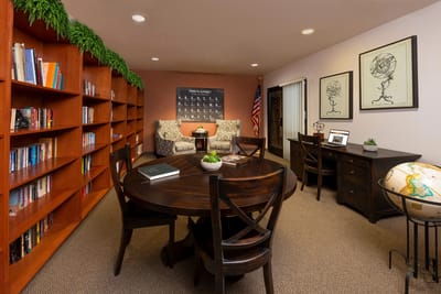 Interior common area with seating and bookshelves