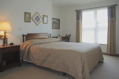 Cozy private resident room with bed and window