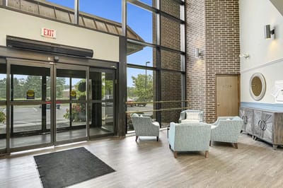 Bright lobby area with seating and large windows