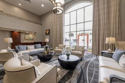 A stylish common area with seating and large windows
