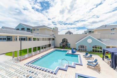 Pool area surrounded by residential buildings