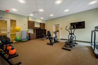 Interior view of a fitness room with exercise equipment
