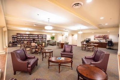 Interior common area with seating and bookshelves
