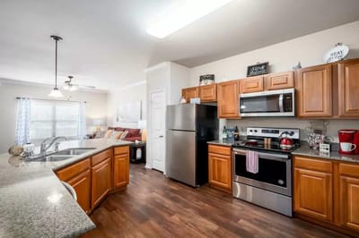 Bright kitchen area with modern appliances and furnishings