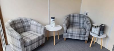 Cozy seating area with patterned chairs and a table