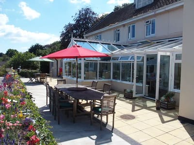 Outdoor seating area with umbrellas and building in background