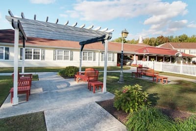 Outdoor seating area with pergola and benches