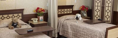 Interior of a private resident room with two beds