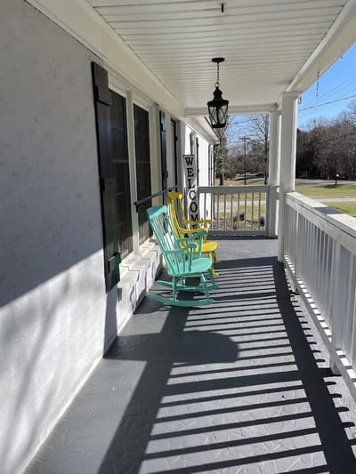 Colorful rocking chairs on a welcoming porch