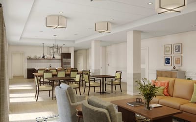 Bright common area with seating and tables