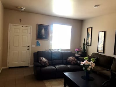 Bright common area with comfortable seating and decor