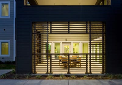 Outdoor view of a shaded seating area with tables