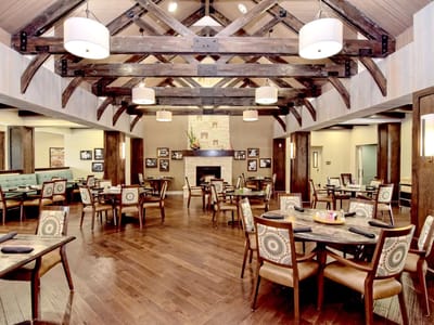 Interior view of a dining room with tables and chairs