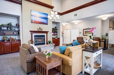Interior of a comfortable common area with seating and a fireplace