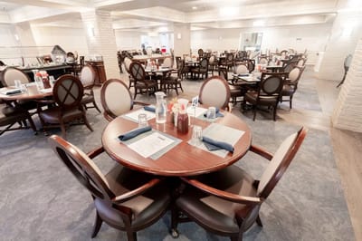 Dining room setup with tables and chairs