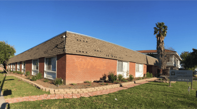 Exterior view of Empress Care Center building with landscaping