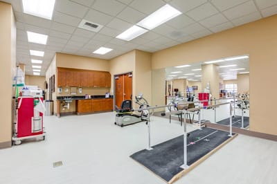 Interior view of a rehabilitation space with exercise equipment