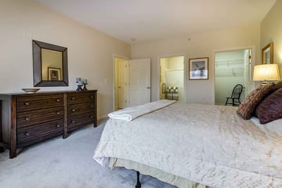 Cozy private room with bed and dresser